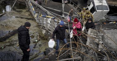 People cross the "bridge of life" near Kyiv amid Russian invasion on Mar. 4, 2022. (Photos by Uğur Yıldırım)