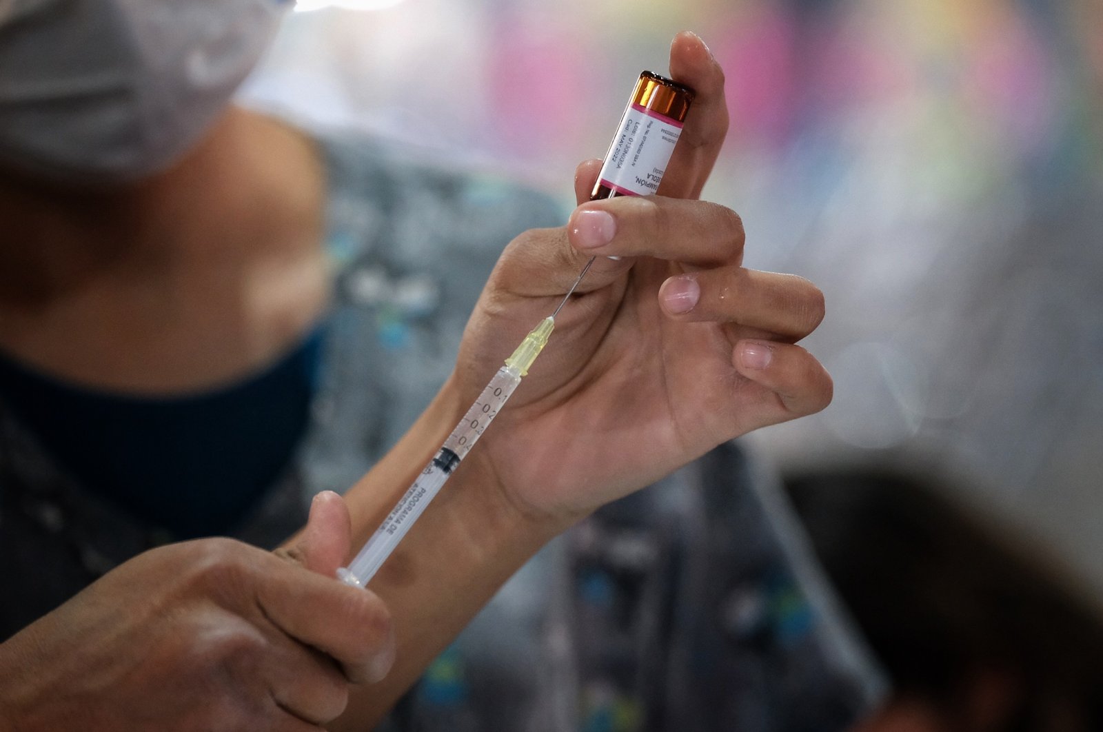 A health care worker prepares a COVID-19 vaccine at a vaccination center in Jalisco, Mexico, March 3, 2022. (Reuters Photo)