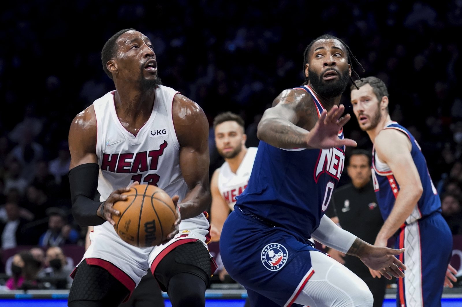 Miami Heat&#039;s Bam Adebayo (L) drives around Brooklyn Nets&#039; Andre Drummond during an NBA game, New York, U.S., March 3, 2022. (AP Photo)
