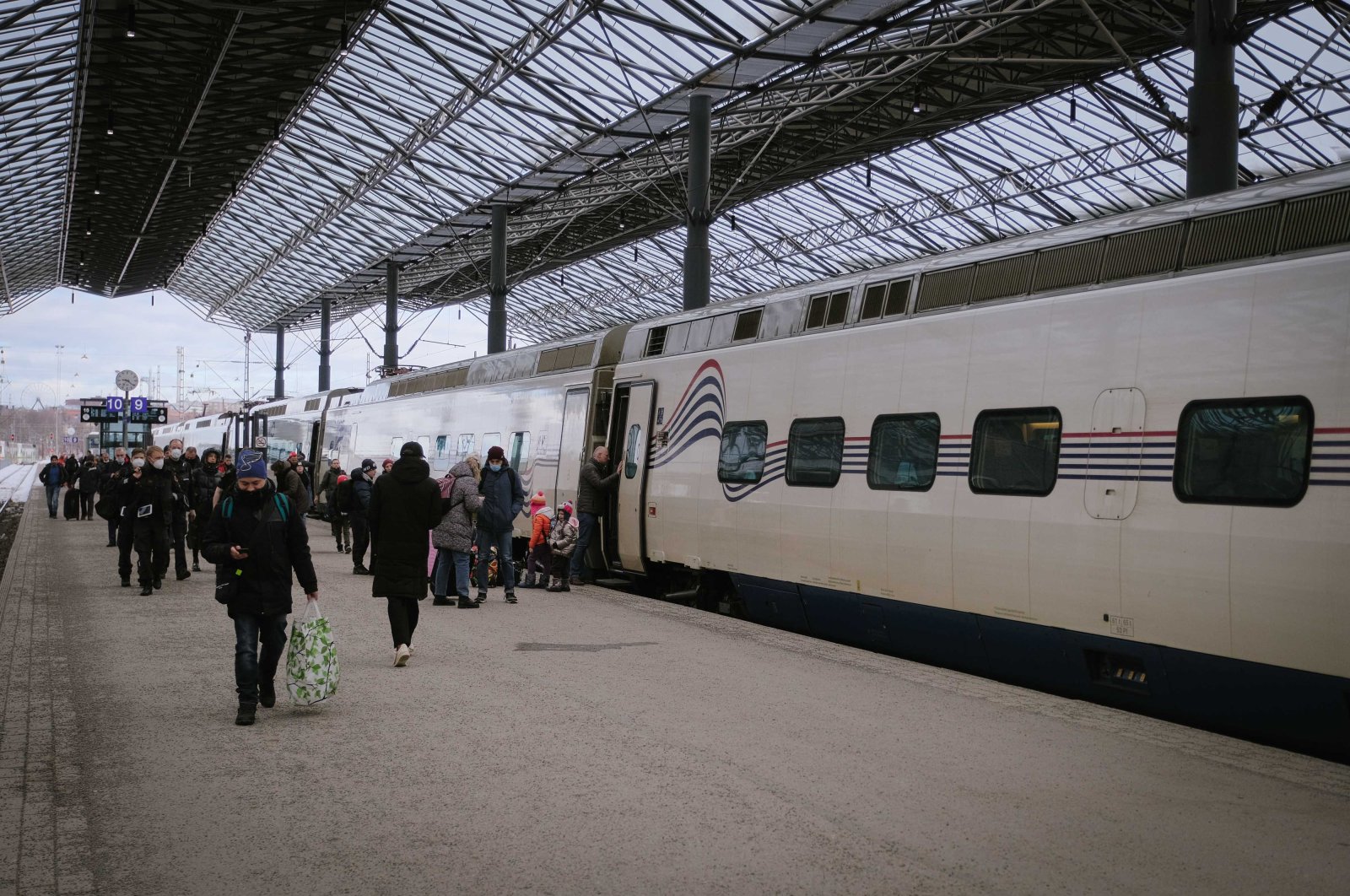 People get off the Allegro train at the central railway station in Helsinki, Finland, March 3, 2022. (AFP Photo)