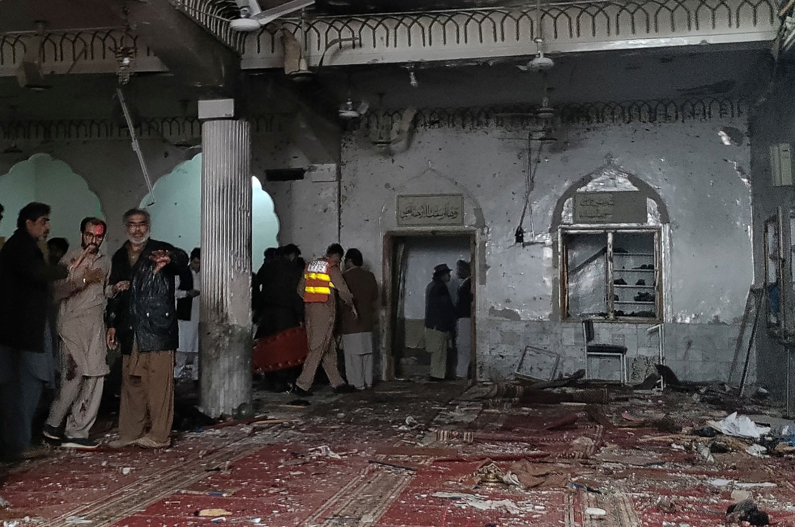 Security personnel inspect a mosque after a bomb blast in Peshawar, Pakistan, March 4, 2022. (AFP Photo)