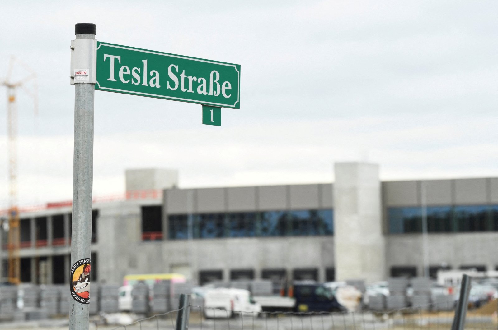 A Tesla sign is seen in front of the construction site of Tesla&#039;s electric car factory in Gruenheide, near Berlin, Germany, March 4, 2022. (REUTERS Photo)