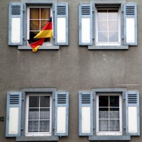 A German flag waves outside a window in this undated photo. (Reuters Photo)