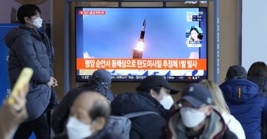 People watch North Korea's missile launch during a news program at the Seoul Railway Station in Seoul, South Korea, March 5, 2022. (AP Photo)