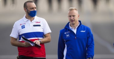 Haas driver Nikita Mazepin (R) of Russia and a member of his team walk the track ahead of Sunday's Formula One Turkish Grand Prix at the Intercity Istanbul Park track, outside Istanbul, Turkey, Oct. 7, 2021. (AP Photo)