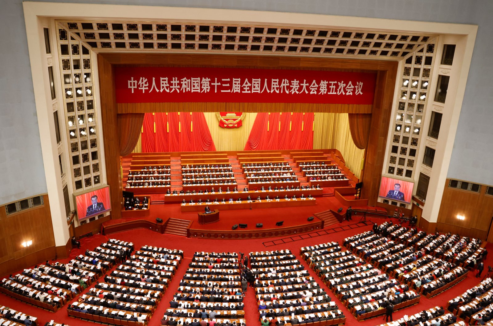 A general view of delegates attending the opening session of the National People&#039;s Congress (NPC) as Chinese Premier Li Keqiang speaks, at the Great Hall of the People in Beijing, China, March 5, 2022. (Reuters Photo)