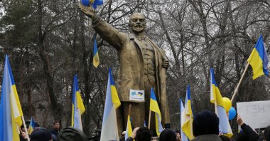 Demonstrators take part in an anti-war protest in support of Ukraine amid the Ukraine-Russia conflict, in front of the monument of Soviet state founder Vladimir Lenin in Almaty, Kazakhstan, March 6, 2022. (Reuters Photo)