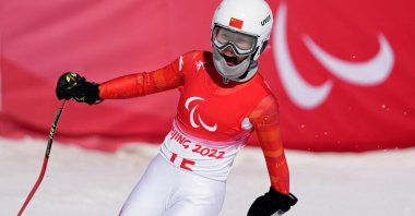 China&#039;s Zhang Mengqiu reacts after her run in the Beijing 2022 Winter Paralympics para-alpine skiing event, Yanqing, China, March 6, 2022. (Reuters Photo)