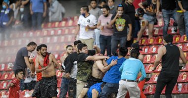 Fans clash during a Mexican football league match between Queretaro and Atlas, Queretaro, Mexico, March 5, 2022. (AP Photo)