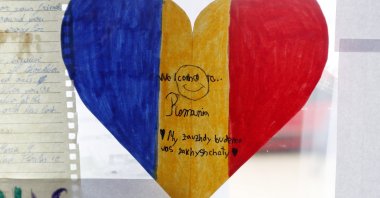 A painting made by a Romanian school child, with a welcome message, is displayed at the entrance of the refugee's transit hub organized by a local businessperson for Ukrainian refugees in his own hotel, in Suceava, northern Romania, March 5, 2022. (EPA Photo)