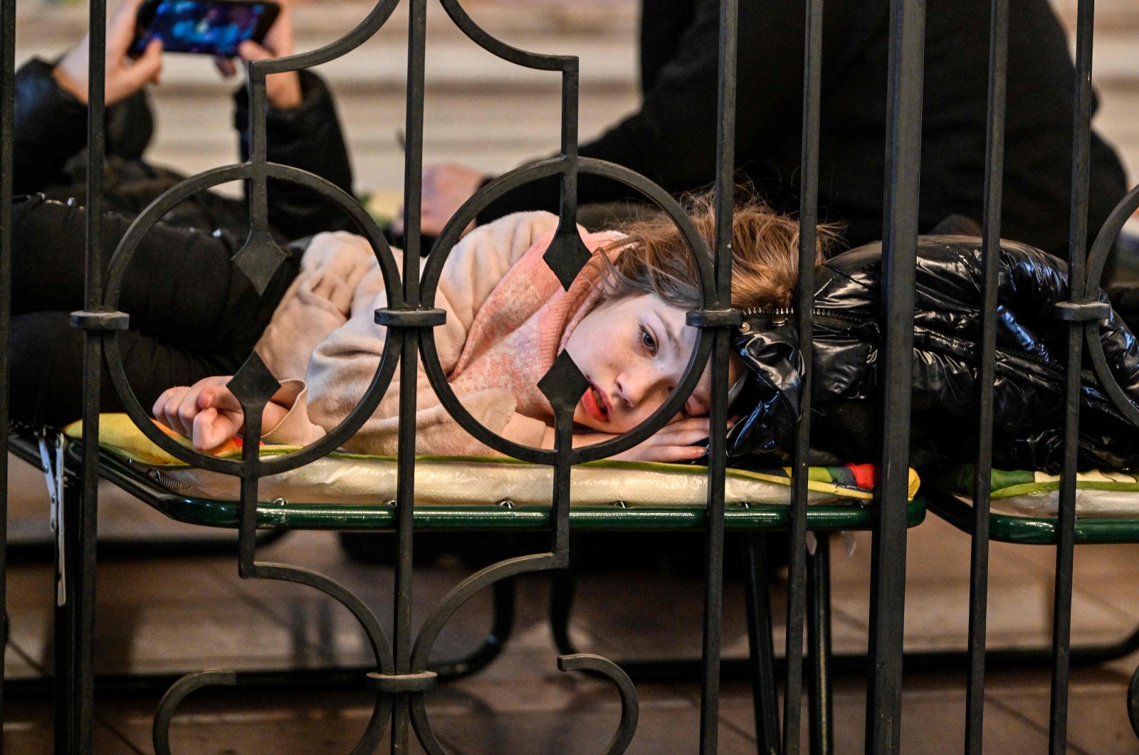 Refugees from Ukraine rest at a temporary shelter in the main train station of Krakow, Poland, March 6, 2022. (AFP Photo)