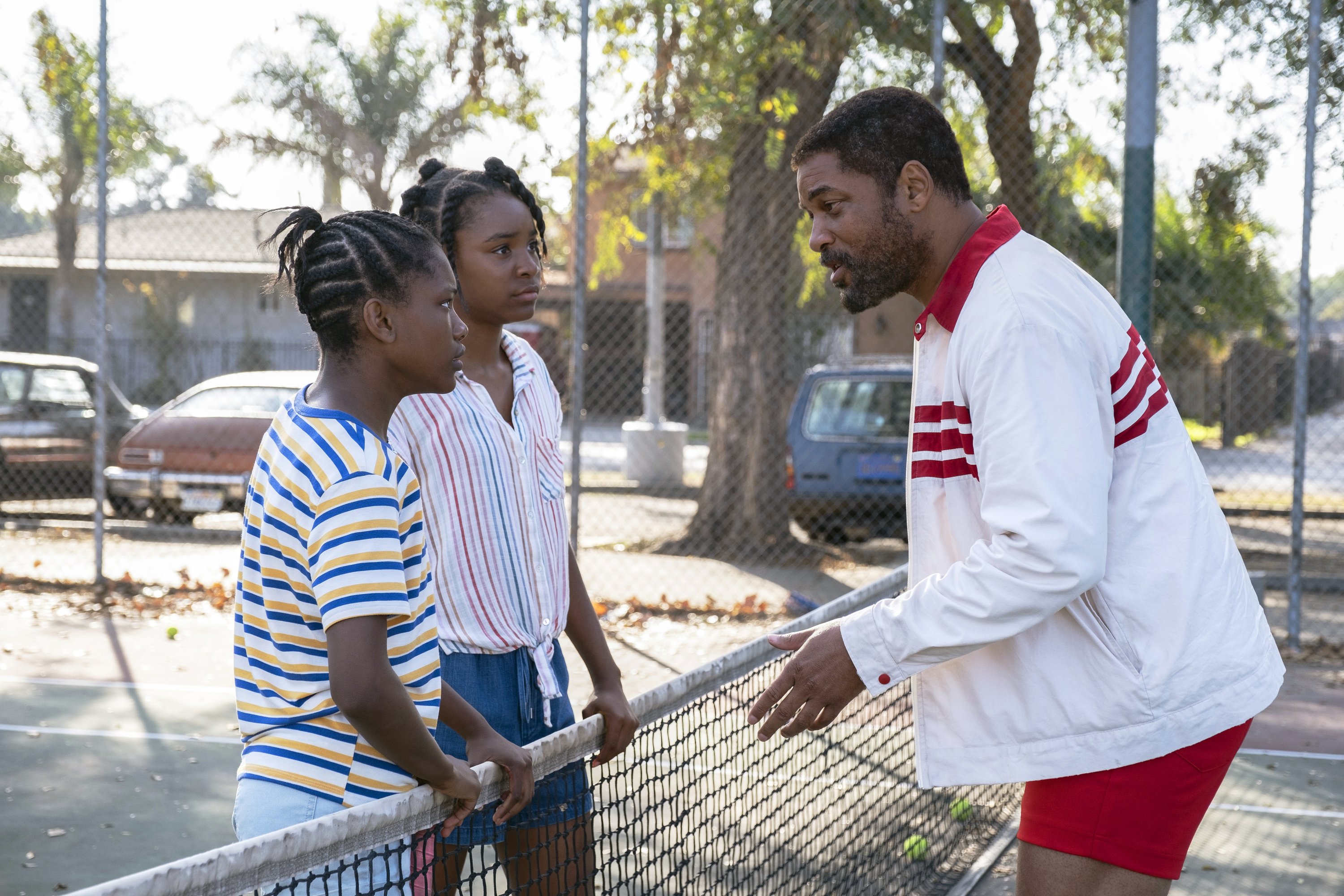 Image released by Warner Bros. Pictures shows Will Smith (R) with Demi Singleton and Saniyya Sidney in a scene from 