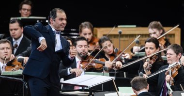 Russian-Ossetian conductor Tugan Sokhiev (L) conducts the Berlin Philharmonic orchestra during their open air concert in Berlin, Germany, June 29, 2019. (EPA Photo) 