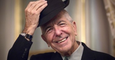Canadian singer and poet Leonard Cohen taking off his hat to salute in Paris, France, Jan. 16, 2021.