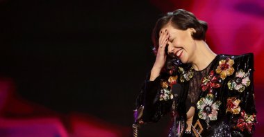 Maggie Gyllenhaal reacts as she receives the Best Director award for &quot;The Lost Daughter&quot; at the 37th Film Independent Spirit Awards in Santa Monica, California, U.S., March 6, 2022. (Reuters Photo)
