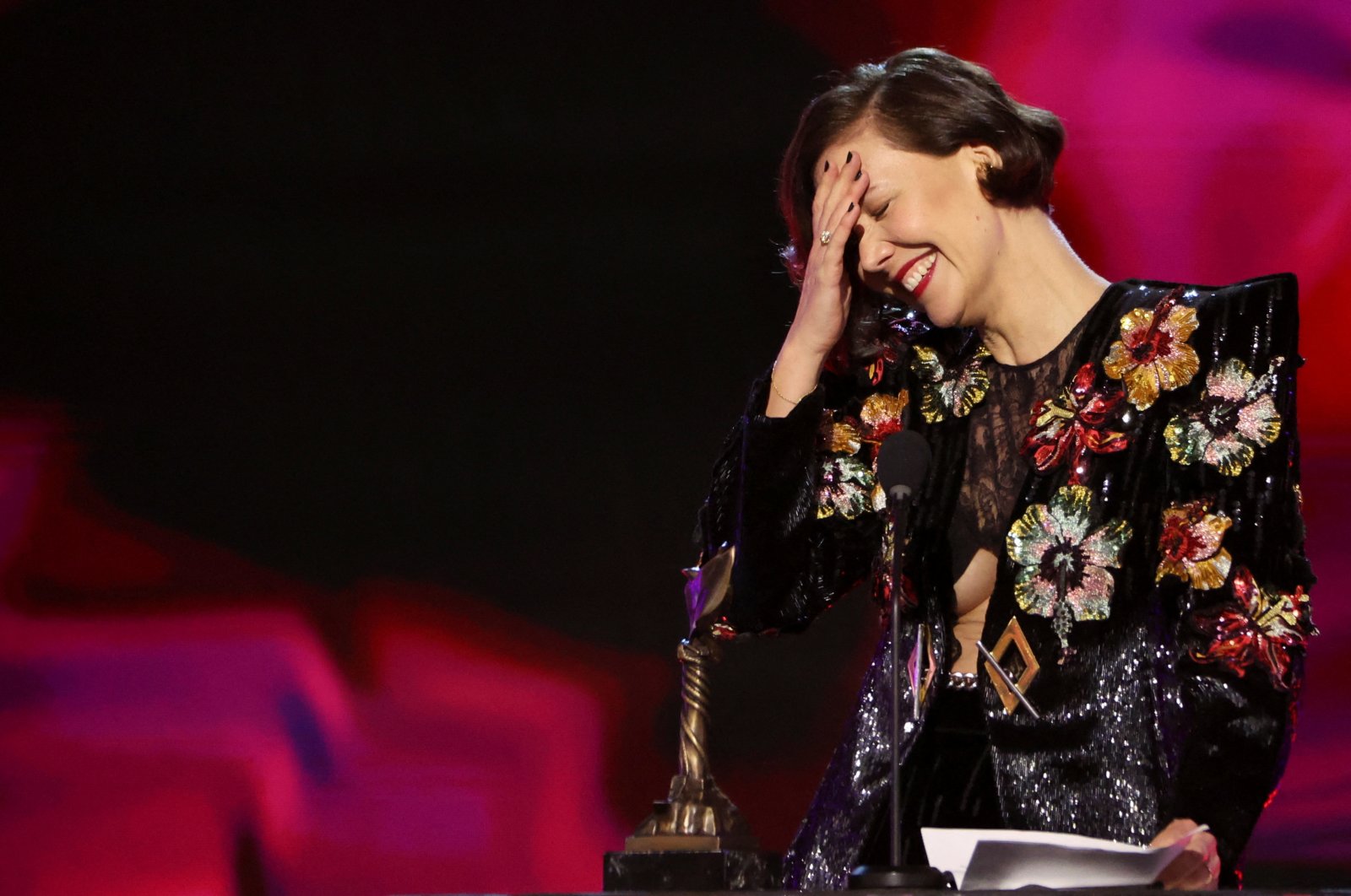 Maggie Gyllenhaal reacts as she receives the Best Director award for &quot;The Lost Daughter&quot; at the 37th Film Independent Spirit Awards in Santa Monica, California, U.S., March 6, 2022. (Reuters Photo)