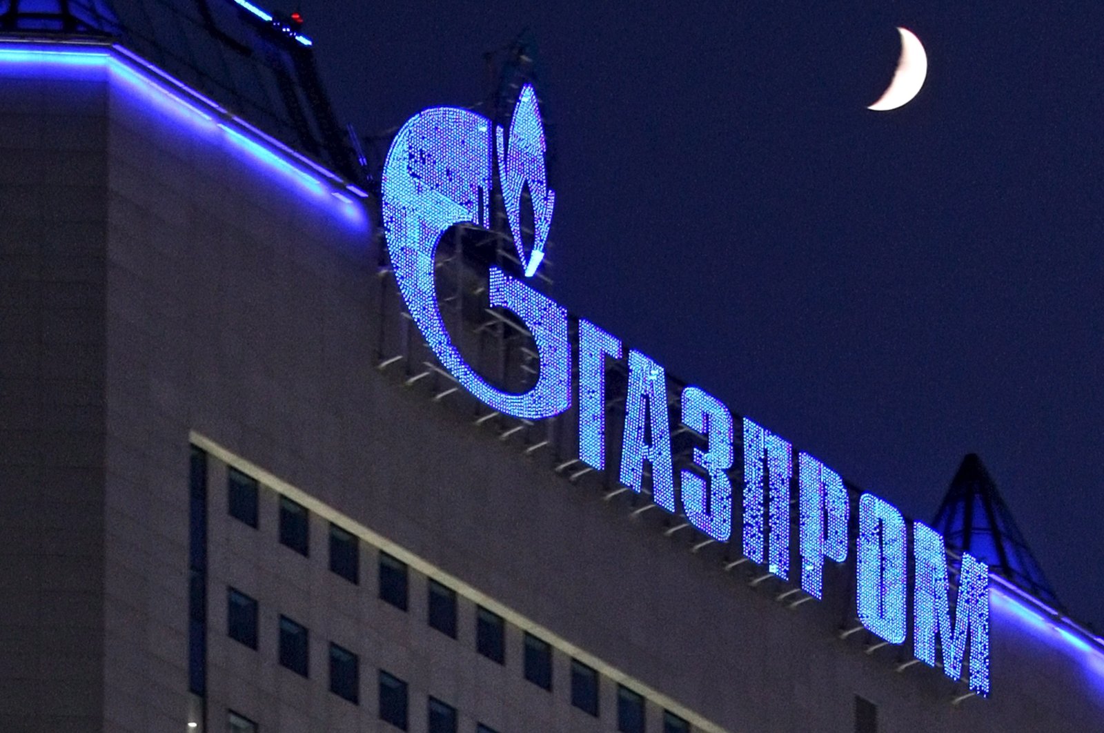 The logo of Russian gas company Gazprom illuminated on Gazprom headquarters in Moscow, Russia, Jan 2, 2009. (EPA Photo)