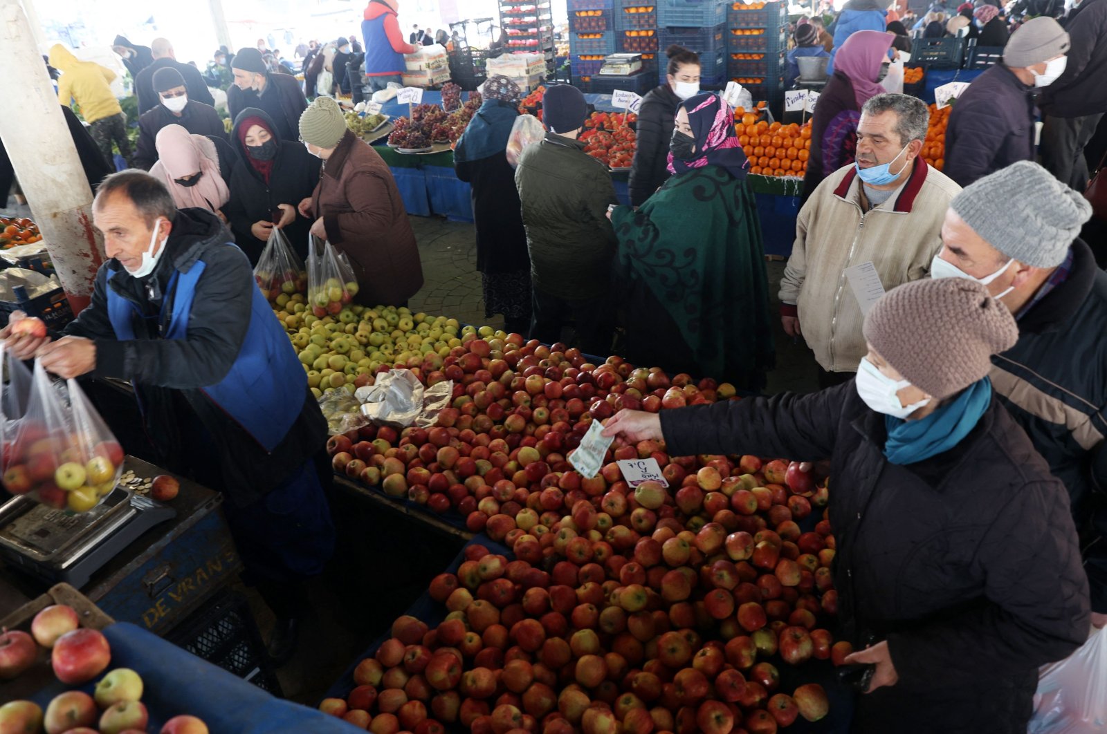 People shop at an open market in Ankara, Turkey, Feb. 4, 2022. (AFP Photo)