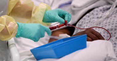 A nurse helps with treatment of a COVID-19 patient in the Intensive Care Unit at Milton Keynes University Hospital, amid the spread of COVID-19 pandemic, Milton Keynes, U.K., Jan. 20, 2021. (Reuters Photo)