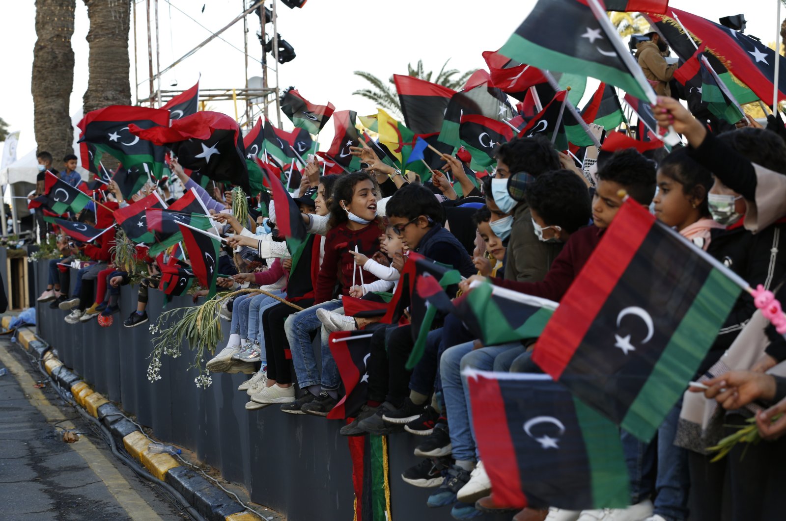 Libyan people celebrate the February Revolution Day in Martyrs' Square in Tripoli, Libya, Friday, Feb. 18, 2022.  (AP File Photo)