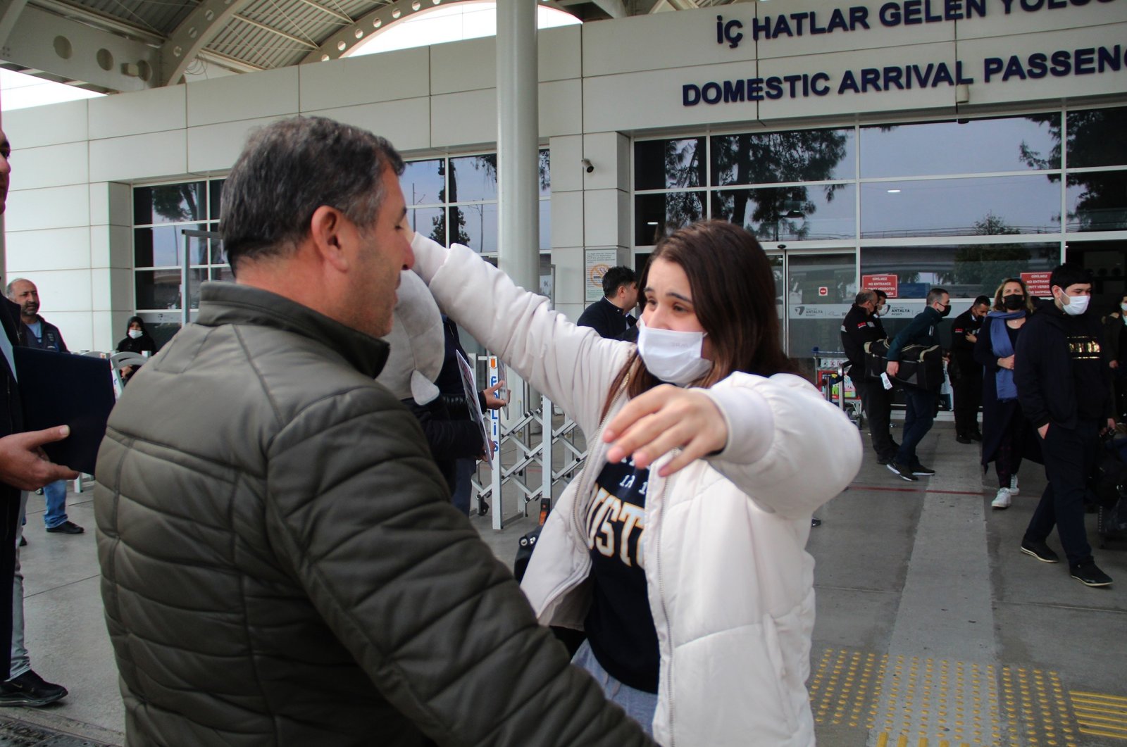 Turkish university student Buse Develi meets with her father in Antalya airport, Turkey, March 7, 2022. (IHA Photo)