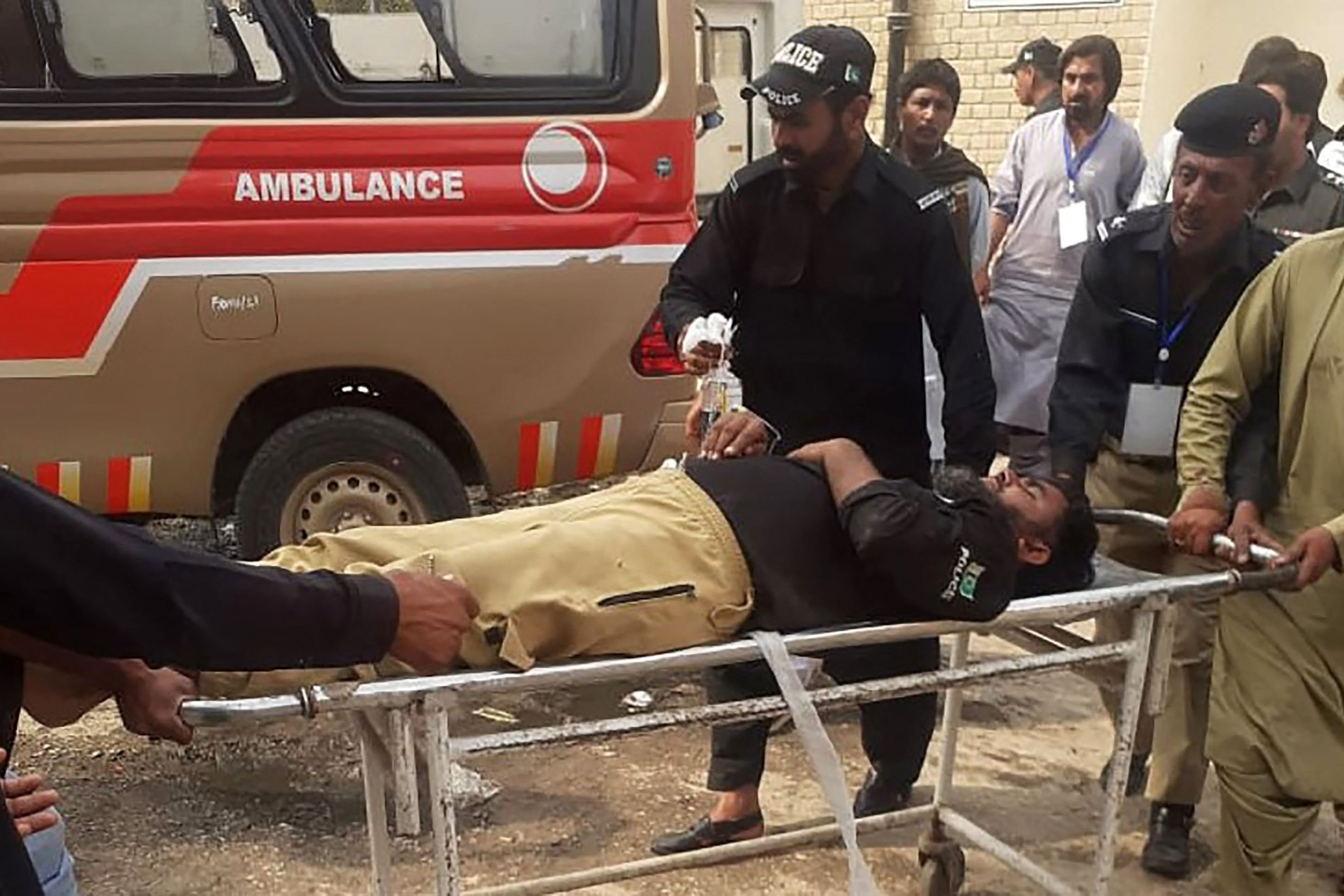 Police carry an injured colleague on a stretcher following a bomb blast in Sibi, Pakistan&#039;s Balochistan province, March 8, 2022. (Photo via AFP)