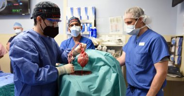 Surgeons perform a transplant of a heart from a genetically modified pig to patient David Bennett in Baltimore, Maryland, U.S., Jan. 7, 2022. (University of Maryland School of Medicine via AFP)