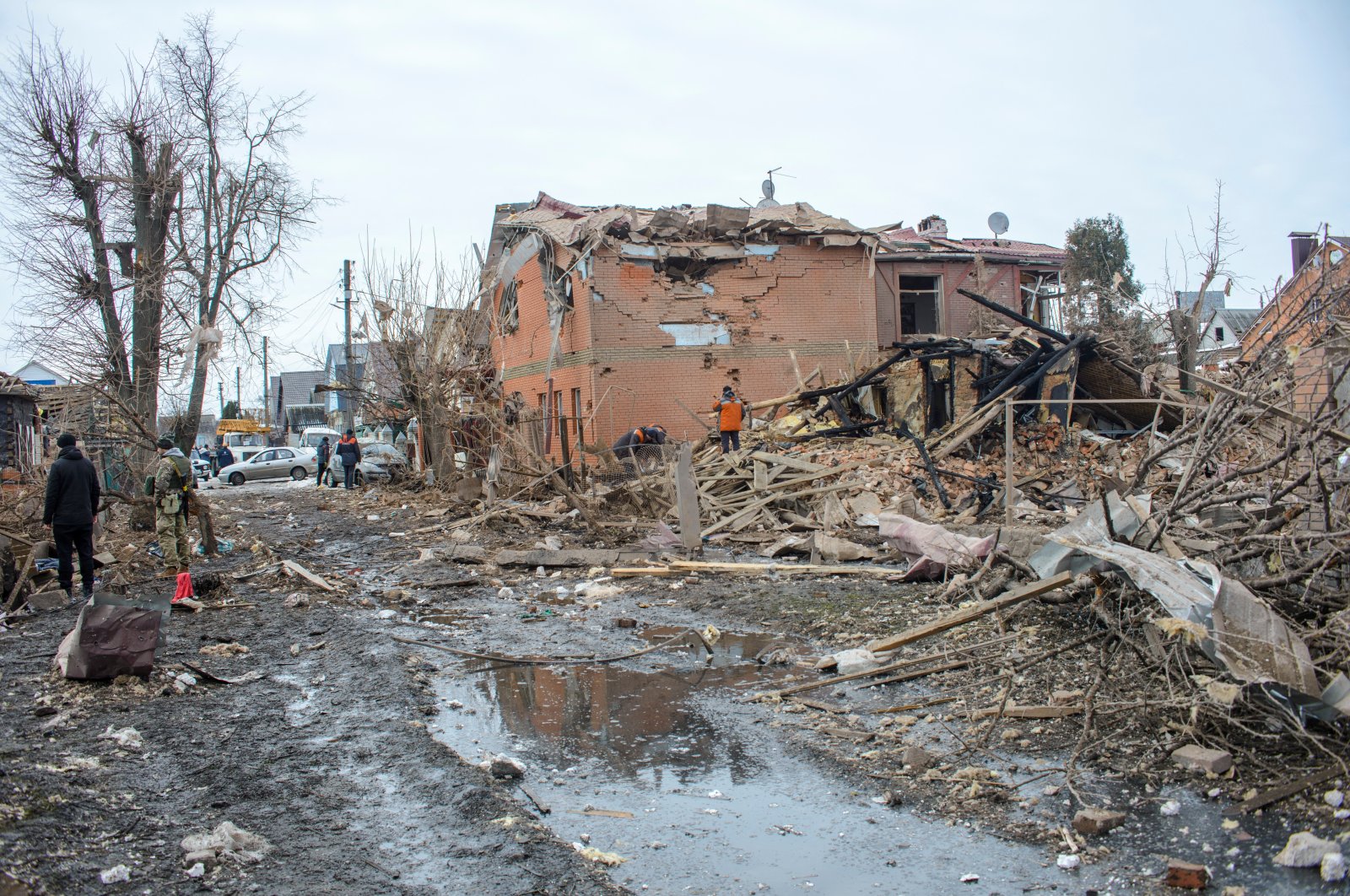 People search through debris near houses destroyed by shelling, amid Russia&#039;s invasion of Ukraine, in Sumy, Ukraine, March 8, 2022. (REUTERS)