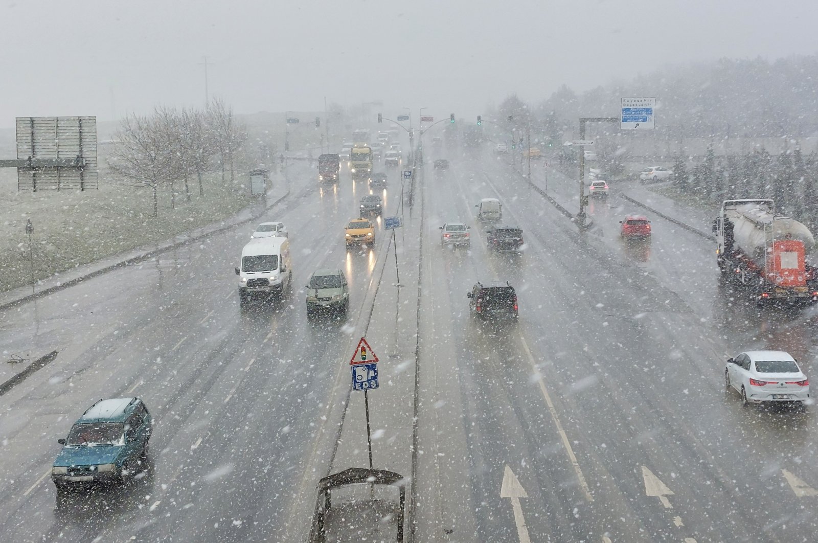 View of a busy road amid slight snowfall, in Istanbul, Turkey, March 9, 2022. (IHA PHOTO)