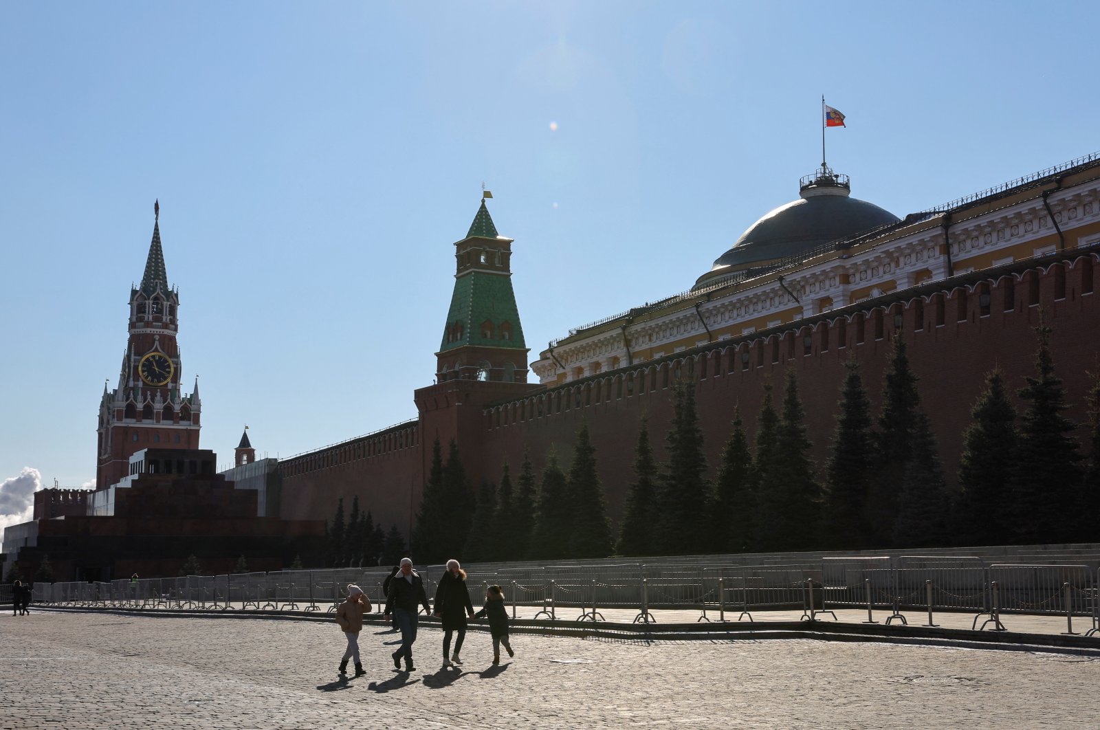 People walk in Red Square near the Kremlin Wall in central Moscow, Russia, March 9, 2022. (Reuters Photo)