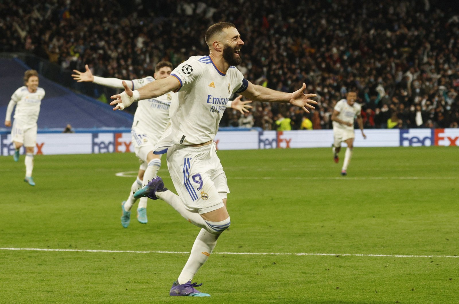 Real Madrid&#039;s Karim Benzema celebrates scoring their third goal during the Champions League Round of 16 Second Leg match against Paris St Germain at Santiago Bernabeu, Madrid, Spain on Mar. 9, 2022 (Reuters Photo)