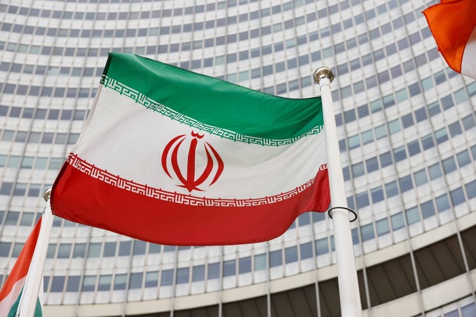 The Iranian flag waves in front of the International Atomic Energy Agency headquarters, Vienna, Austria, May 23, 2021. (Reuters Photo)