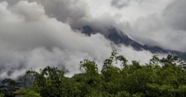 Mount Merapi spews volcanic materials seen from Cangkringan village in Sleman, Yogyakarta, Indonesia, March 10, 2022. (AP Photo)