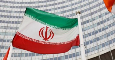 The Iranian flag waves in front of the International Atomic Energy Agency headquarters, Vienna, Austria, May 23, 2021. (Reuters Photo)
