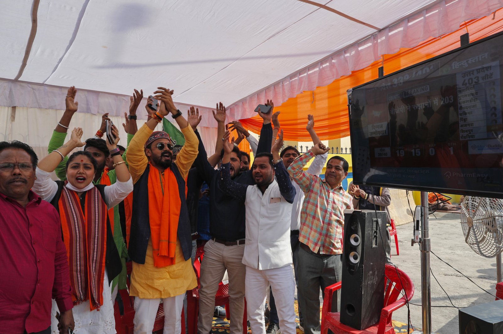 Bharatiya Janata Party (BJP) workers celebrate early leads for the party as election officials count votes after Uttar Pradesh state elections in Lucknow, India, March 10, 2022. (AP Photo)