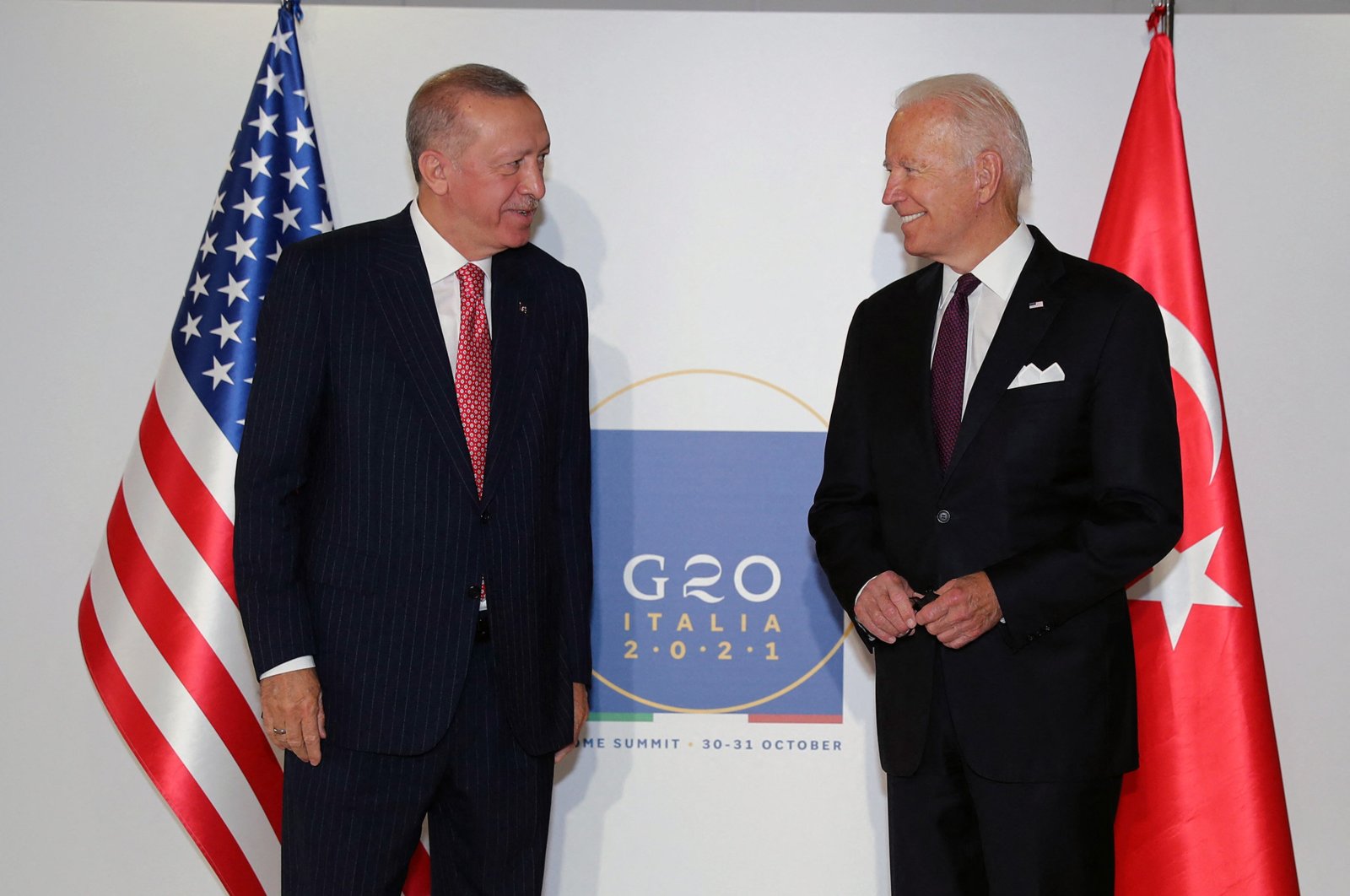 This handout photograph taken and released by the Turkish Presidential Press Service shows President Recep Tayyip Erdoğan (L) and U.S. President Joe Biden posing before their meeting during the G-20 Summit at the Roma Convention Center La Nuvola, Italy, Oct. 31, 2021. (AFP File Photo)