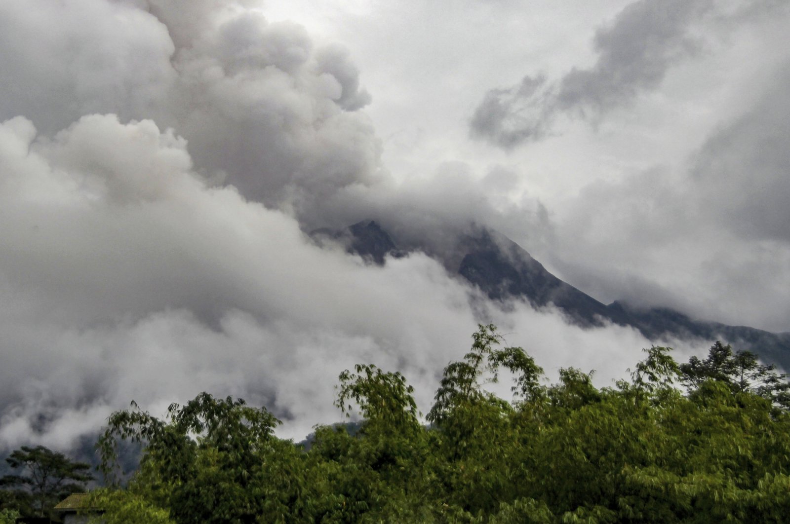 Mount Merapi spews volcanic materials seen from Cangkringan village in Sleman, Yogyakarta, Indonesia, March 10, 2022. (AP Photo)