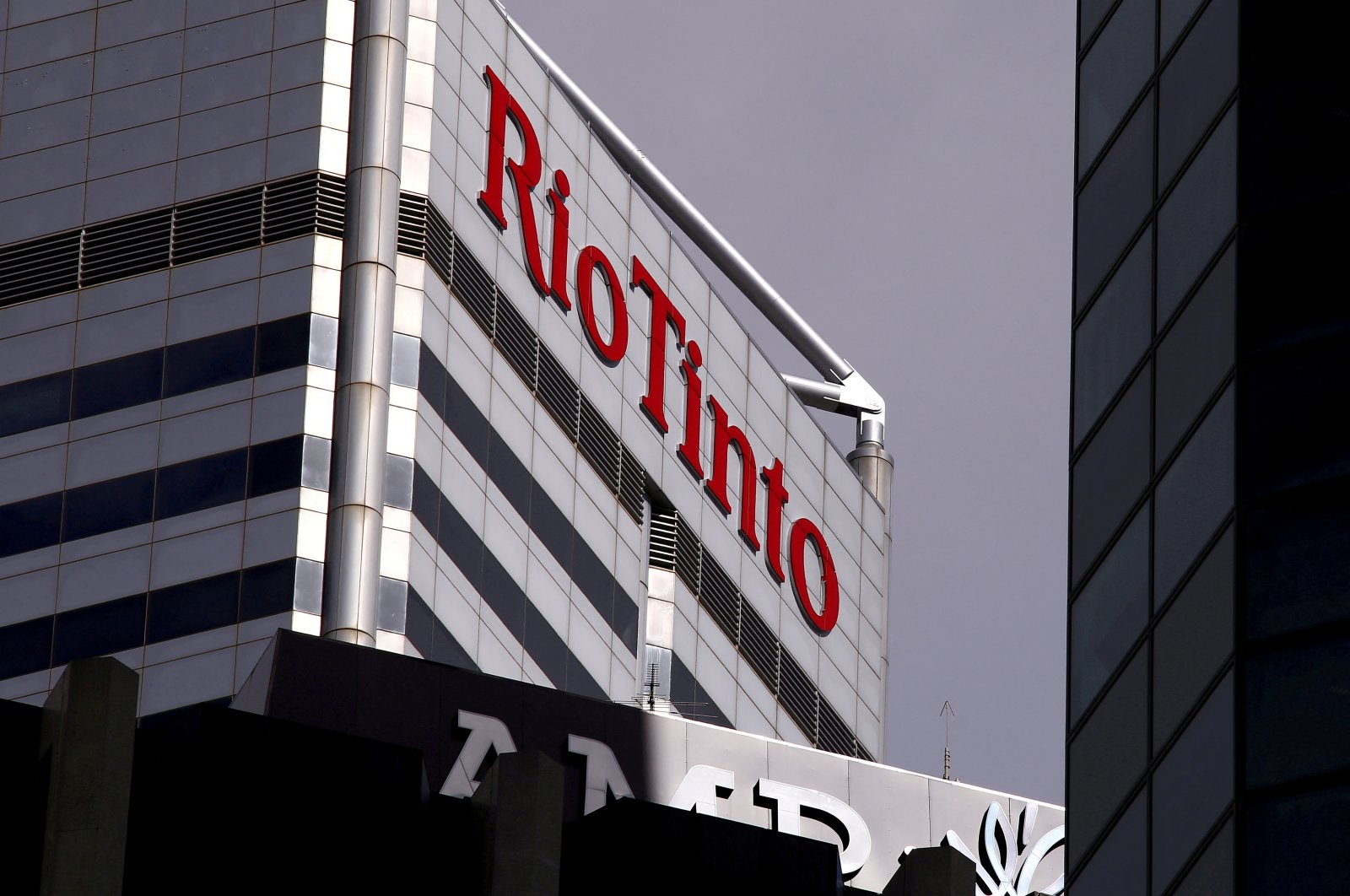 A sign adorns the building where mining company Rio Tinto has its office in Perth, Western Australia, Nov. 19, 2015.