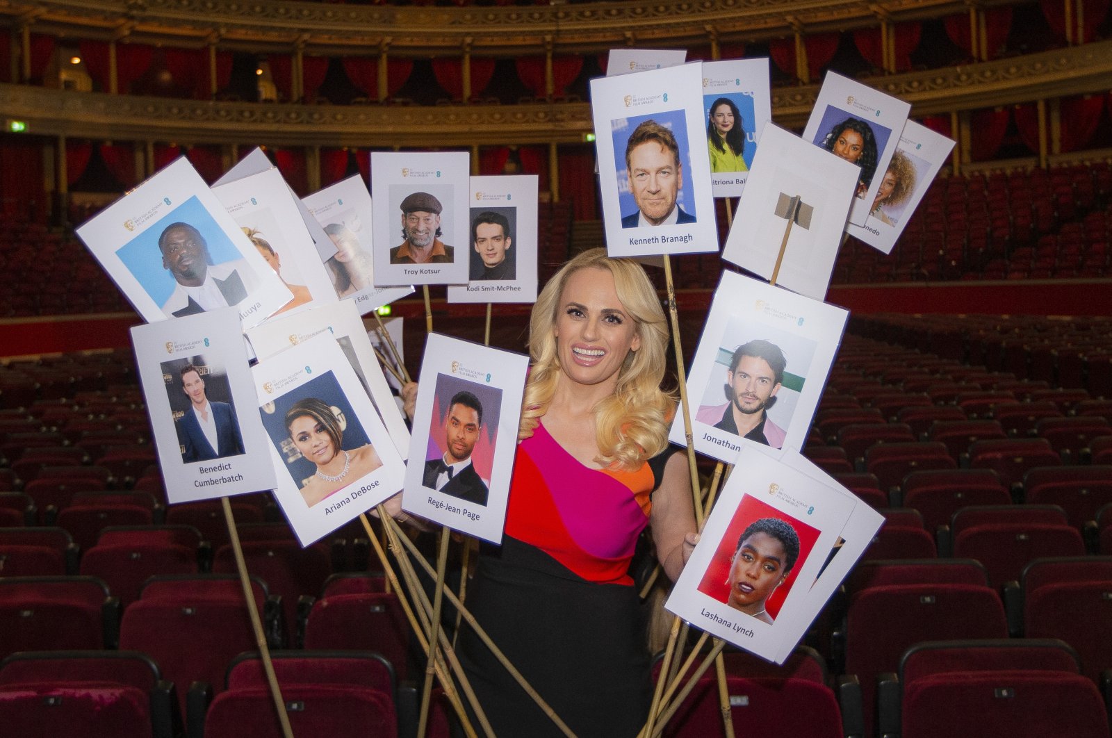 Rebel Wilson poses for photographers amongst the seating plan ahead of the British Academy Film Awards on that take place on Sunday, March 13, at the Royal Albert Hall in central London, Tuesday, March 8, 2022. (AP)