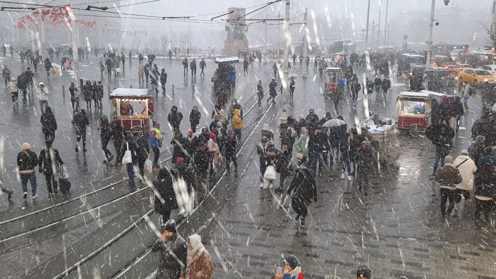 Snowing in Taksim Square, Istanbul, Turkey, March 11, 2022. (IHA Photo)