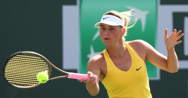 Ukraine's Marta Kostyuk in action against Maryna Zanevska at the Indian Wells Tennis Tournament in Indian Wells, California, U.S., March 10, 2022. (AFP Photo)