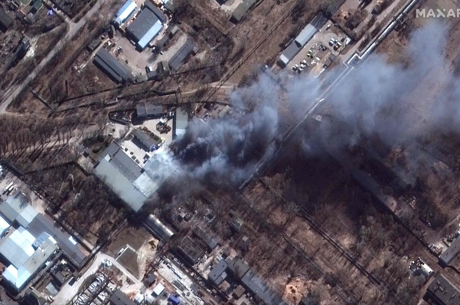 This Maxar satellite image taken and released on March 10, 2022, shows a close-up of fires burning in an industrial area in southern Chernihiv, Ukraine. (AFP Photo / Satellite image ©2022 Maxar Technologies)