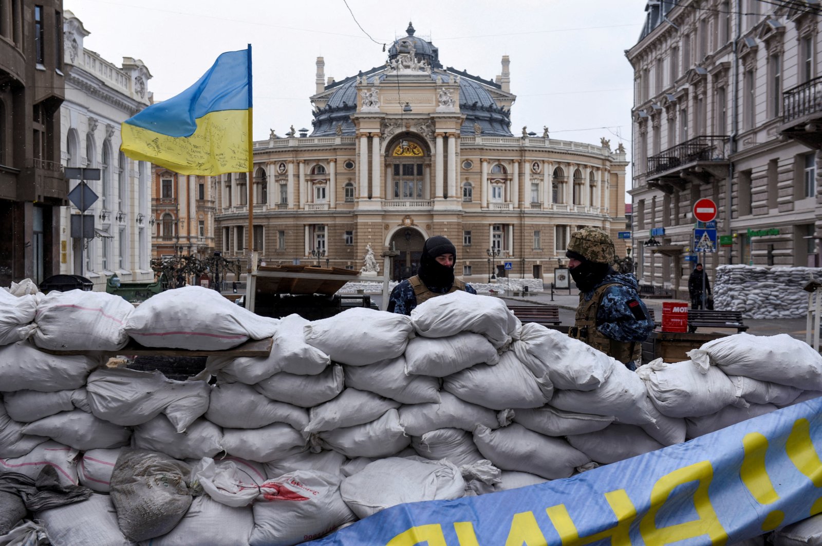 Soldiers stand guard behind a barricade, with the Odessa National Academic Opera and Ballet Theater seen in the background, amid Russia&#039;s invasion of Ukraine, in Odessa, Ukraine, March 10, 2022. (Reuters Photo)
