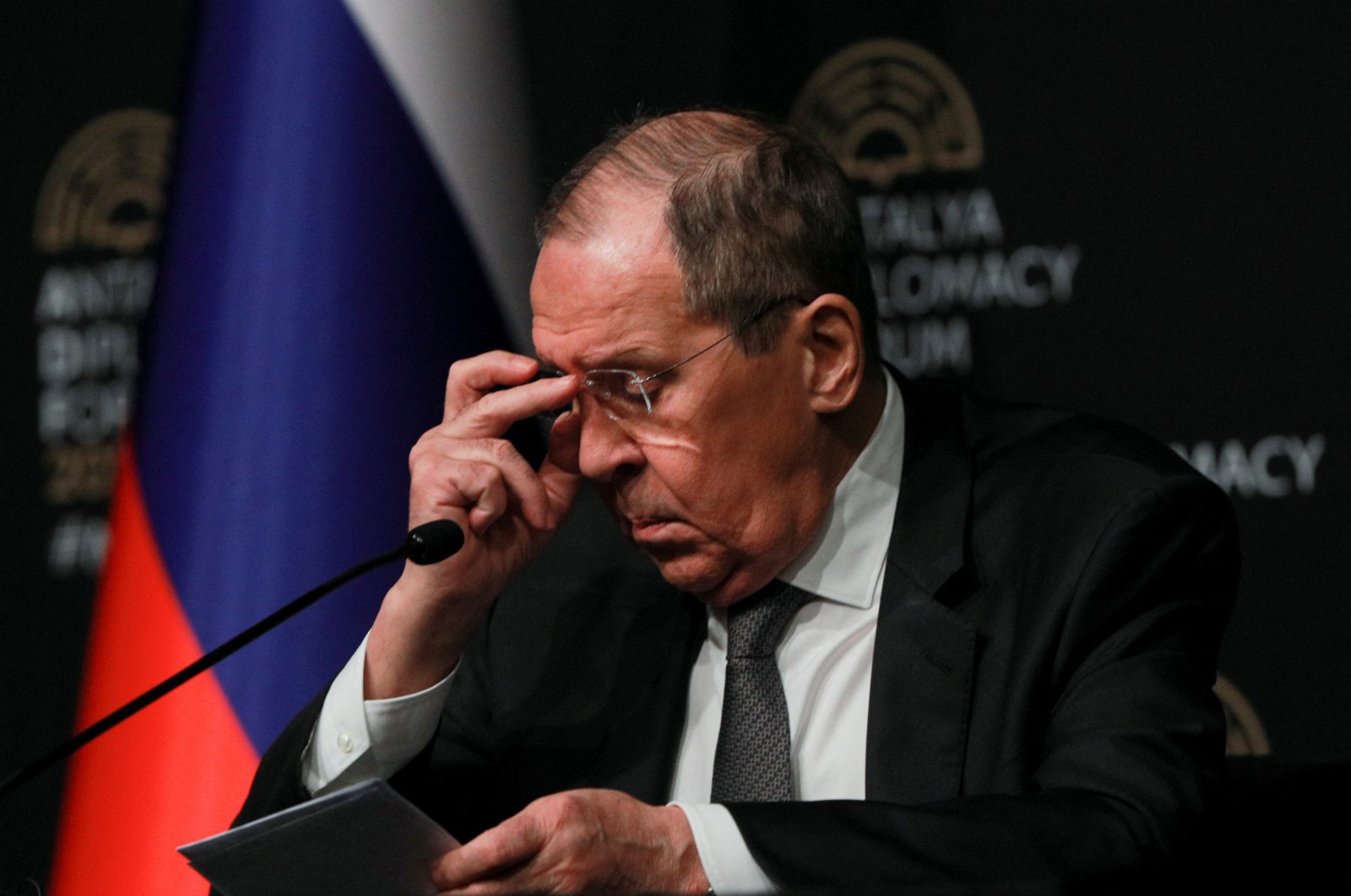 Russian Foreign Minister Sergei Lavrov adjusts his glasses during a news conference after meeting with his counterparts Ukrainian Dmytro Kuleba and Mevlut Çavuşoğlu, amid Russia&#039;s invasion of Ukraine, in Antalya, Turkey March 10, 2022. (Reuters Photo)