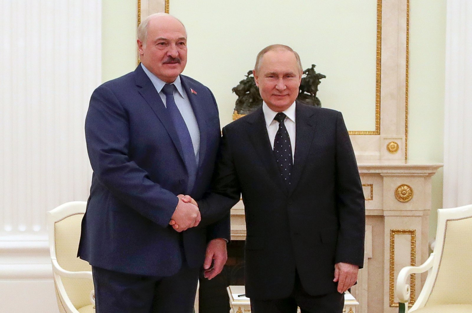 Russian President Vladimir Putin, (R), and Belarusian President Alexander Lukashenko pose for a photo during their meeting in Moscow, Russia, Friday, March 11, 2022. (AP Photo)