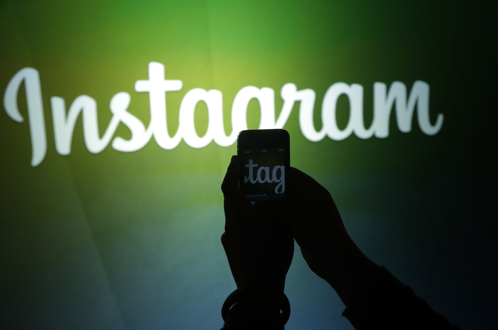 A journalist makes a video of the Instagram logo using the new video feature at Facebook headquarters in Menlo Park, Calif., U.S., June 20, 2013. (AP File Photo)