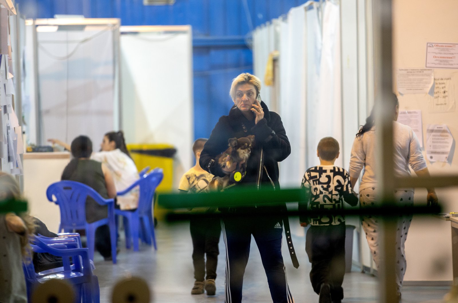 People evacuated from Ukraine rest at the refugee trial camp at MoldExpo national exhibition center in Chisinau, Moldova, March 11, 2022. (EPA Photo)