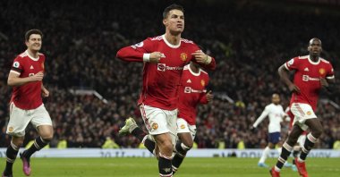 Manchester United&#039;s Cristiano Ronaldo (C) celebrates after scoring in a Premier League match against Tottenham Hotspur, Manchester, England, March 12, 2022. (AP Photo)