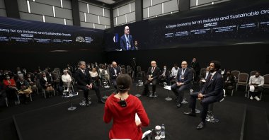 Speakers are seen during the panel entitled "A green economy for an inclusive and sustainable growth" on the sidelines of Antalya Diplomacy Forum in Antalya, southern Turkey, March 12, 2022. (AA Photo)