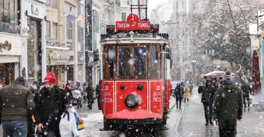 People walk on Istiklal Avenue, in Istanbul, Turkey, March 13, 2022. (AA PHOTO)